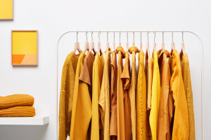 Clothes hanging on a rack.