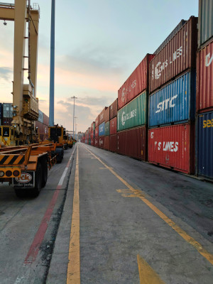 View of a container terminal with stacked cargo containers and trailers during the India–Pakistan trade ban in May 2025.