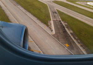 View of an airport runway seen from a landing plane.