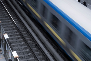 Train rapidly driving past a railway track.