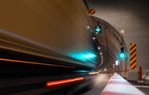 Lights of a truck driving through a tunnel.