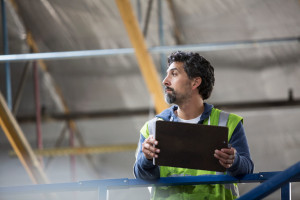 Warehouse worker inspecting goods.
