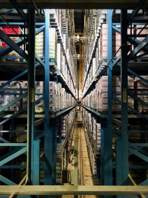 Goods standing inside a warehouse shelf.